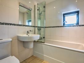 A bathroom with a toilet sink bathtub and shower at Trevelyan in Marhamchurch