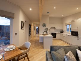 A kitchen and dining area at Trelowen 3.0 Spa in Marhamchurch