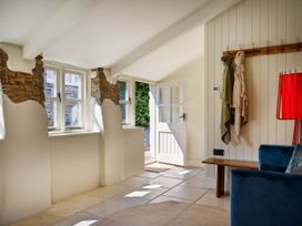 An entryway with a door and windows at Whalesborough Farmhouse Spa Marhamchurch