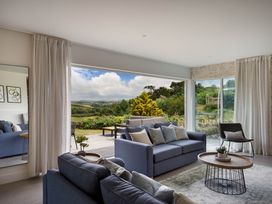 A living room with a sofa and coffee table at Whalesborough Cottage Spa, Marhamchurch