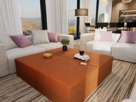 A living room with a coffee table and sofas at Kew Villa (Pet) Marhamchurch