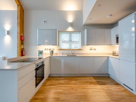 A kitchen with modern appliances at Tranquillity 4 in Carnforth