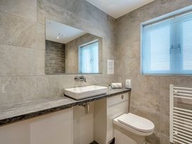 A bathroom with a sink and toilet at Tranquillity 4 in Carnforth