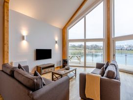 A living room with a view of water at Tranquillity 4 (Pet) in Carnforth