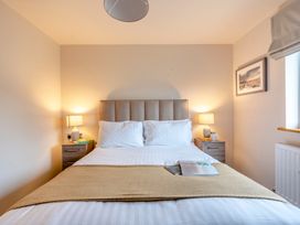 A bedroom with a bed and nightstands at Tranquillity 4 (Pet) in Carnforth