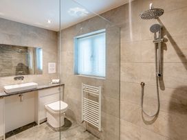 A bathroom with a sink, toilet, and shower at Tranquillity 4 (Pet) in Carnforth