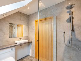 A bathroom with a shower and sink at Tranquillity 4 (Pet) in Carnforth