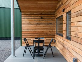 An outdoor seating area with a table and chairs at The Telfer in North Berwick