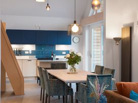 A kitchen with a dining table and chairs at The Telfer in North Berwick