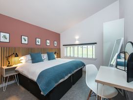 A bedroom with a bed and a desk at The Telfer in North Berwick