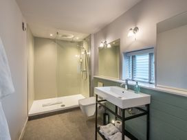 A bathroom with a shower, sink, and toilet at The Telfer in North Berwick