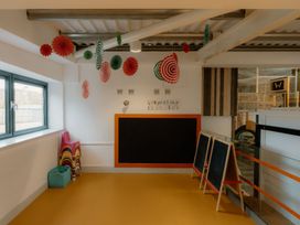A classroom with colorful chairs and chalkboard at The Telfer in North Berwick