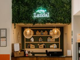 A reception area with a desk and wall art at Landal in North Berwick