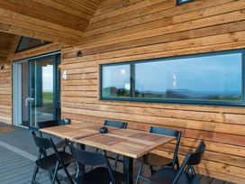 A terrace with a table and chairs at The Irvine in North Berwick