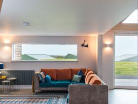 A living room with a sofa and a table at The Irvine in North Berwick