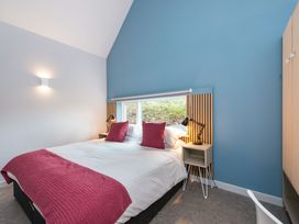 A bedroom with a bed and table at The Irvine in North Berwick