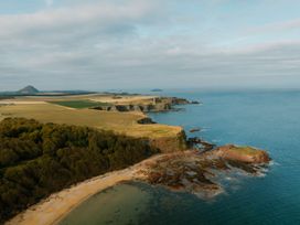 A coastal view of cliffs and sea at The Irvine in North Berwick