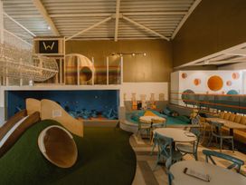 A play area with slides and climbing structures at The Irvine in North Berwick
