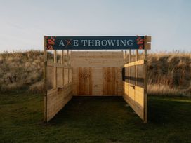 An axe throwing structure with target boards at The Irvine in North Berwick