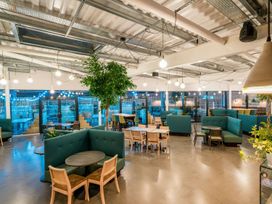 A restaurant seating area with tables and sofas at The Irvine in North Berwick
