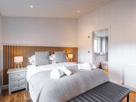 A bedroom with a bed and bedside table at The Townsend in North Berwick