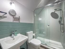 A bathroom with a shower and washbasin at The Laidlaw Spa in North Berwick