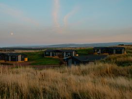 Multiple houses on grassland at The Laidlaw Spa in North Berwick