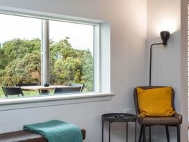 A living room with a window and seating area at The Laidlaw in North Berwick