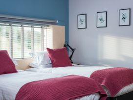 A bedroom with two beds and wall art at The Laidlaw in North Berwick