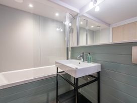 A bathroom with a sink and bathtub at The Laidlaw in North Berwick