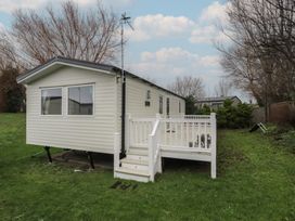 A mobile home with a staircase and railing at Willerby Ellerrton (delyn)