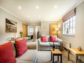 A living room with a sofa and a small table at Arran Lodge Spa in Dailly