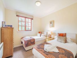 A bedroom with two beds and a window at Turnberry in Dailly