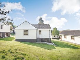 A house with steps and grass at Turnberry in Dailly