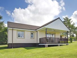 A house with a deck and windows at Brunston in Dailly
