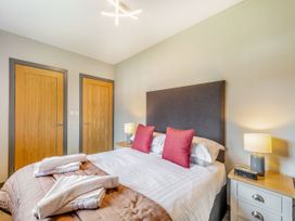 A bedroom with a bed and bedside tables at Brunston in Dailly