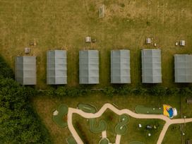 An aerial view of cabins and a mini golf area at Lancaster Lodge in Fair Oak