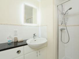 A bathroom with a sink and shower at 8 Thurlestone Beach Kingsbridge