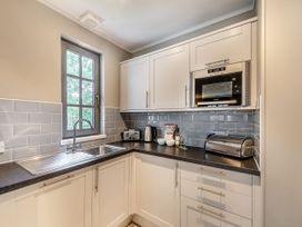 A kitchen with a sink and appliances at Ailsa Craig Spa Dailly