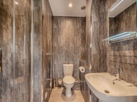 A bathroom with a sink, toilet and shower at Ailsa Craig Spa, Dailly