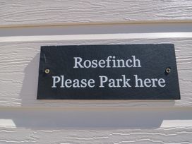 A sign that says Rosefinch Please Park here at Rosefinch Cabin Staintondale near Scarborough
