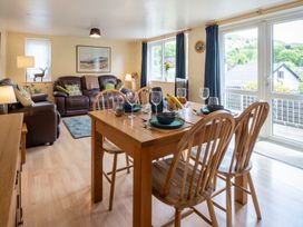 A dining room with a table and chairs at Oaks Lodge Cottage Ambleside