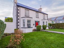 A house with a garden and a red front door at San Antonio, Dungloe, County Donegal