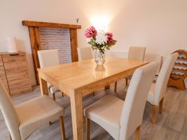 A dining room with a table and chairs at San Antonio in Dungloe, County Donegal