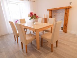 A dining room with a table and chairs at San Antonio Dungloe, County Donegal