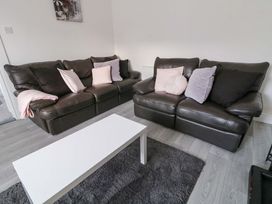 A living room with sofas and a coffee table at San Antonio in Dungloe, County Donegal