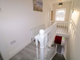 A staircase with a red front door at San Antonio, Dungloe, County Donegal