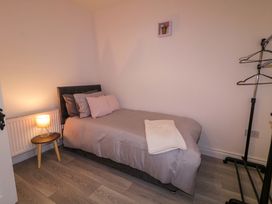 A bedroom with a bed and side table at San Antonio in Dungloe, County Donegal
