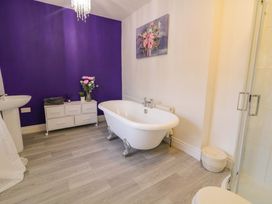 A bathroom with a bathtub and sink at San Antonio, Dungloe, County Donegal