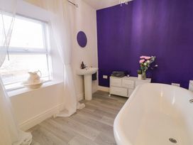 A bathroom with a bathtub and sink at San Antonio in Dungloe, County Donegal